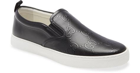 gucci embossed slip on sneakers.